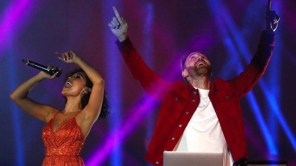 Raye performing with David Guetta last year