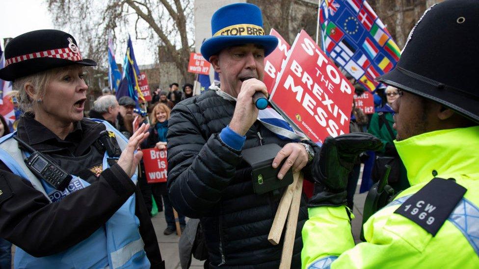 Police trying to stop Mr Bray playing anti Brexit songs outside Westminster