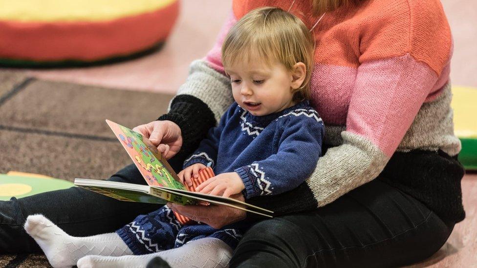 Baby reading a book