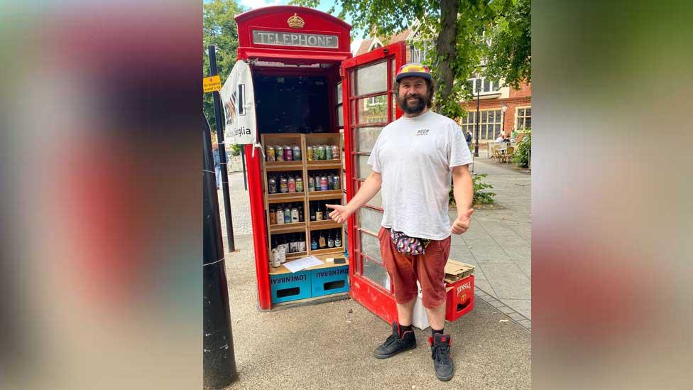 Saul Press with off licence in phone box