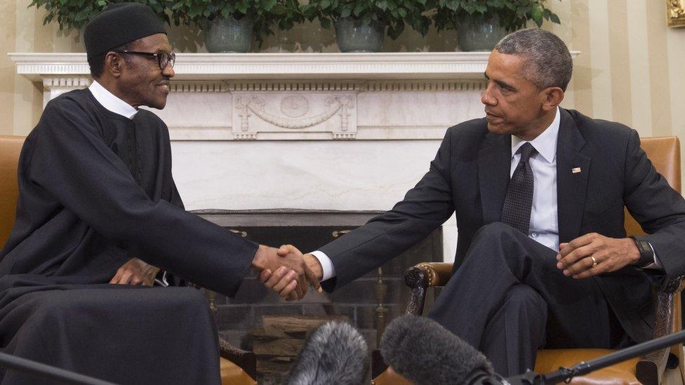 US President Barack Obama shakes hands with Nigerian President Muhammadu Buhari during a meeting in the Oval Office of the White House in Washington, DC, July 20, 2015.