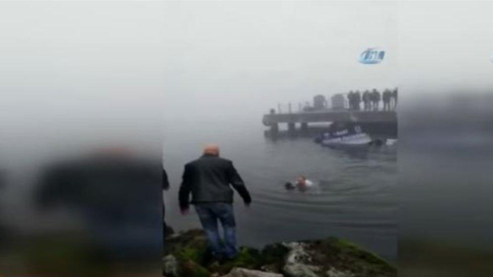 Camera video footage shows the mayor of Karamursel, Turkey, swimming to the aid of a diver in difficulties