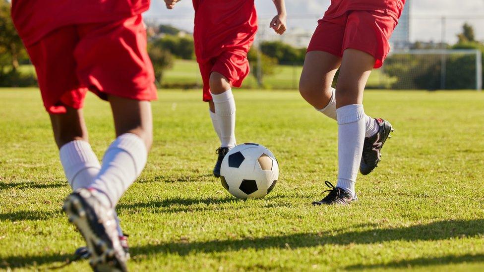 children-playing-football.