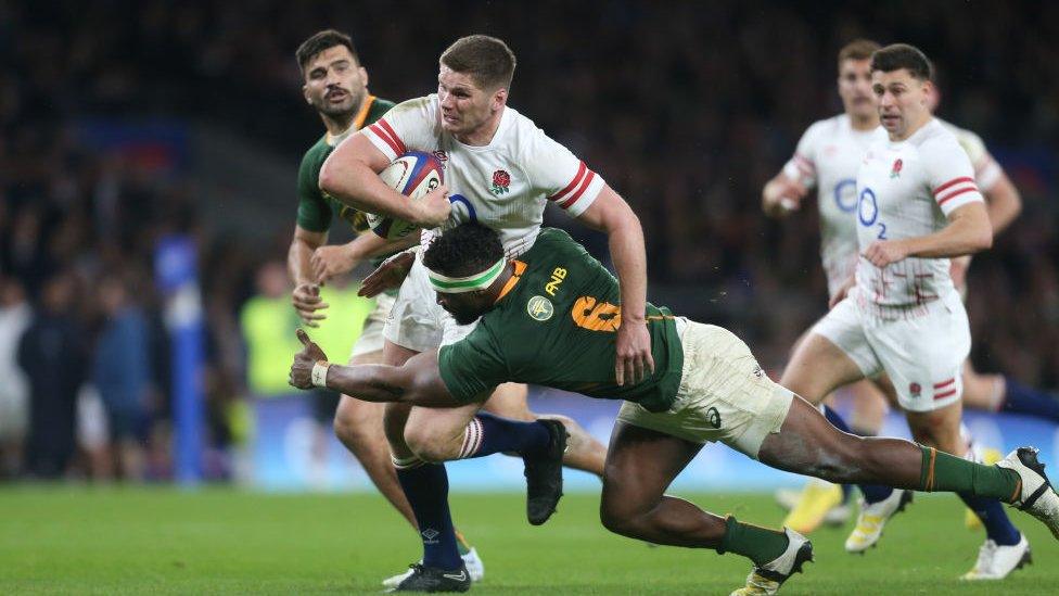 England's Owen Farrell is tackled by South Africa's Siya Kolisi during the Autumn International match between England and South Africa .