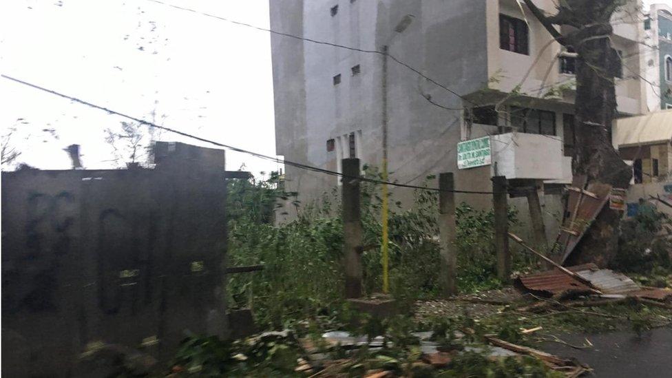 Storm damage and collapsed fencing in Tuguegarao