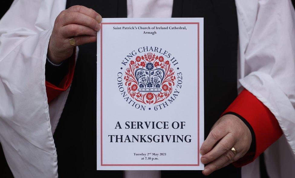 A man holds an order of service for the thanksgiving event at St Patrick's Cathedral in Armagh