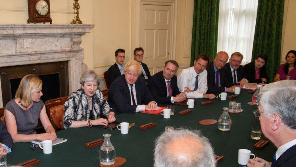 Theresa May (4th L) holds the first Cabinet meeting of her new team at 10 Downing Street