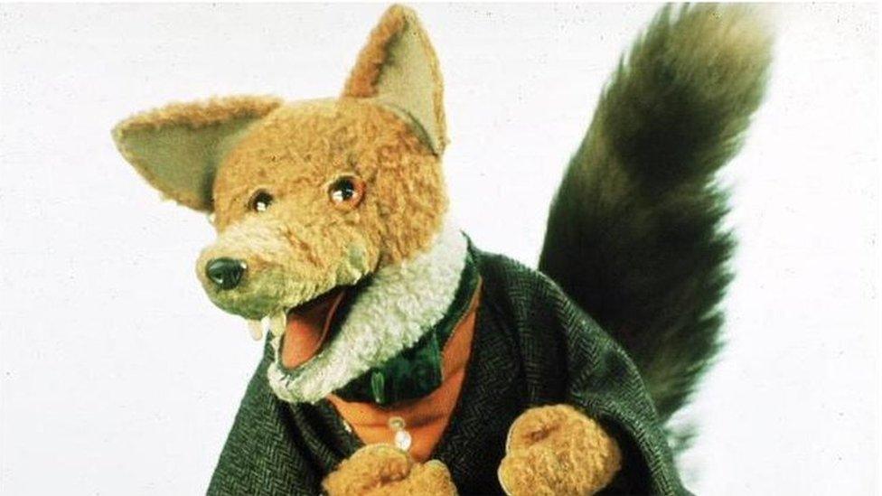 Basil Brush fox character wearing his green jacket.