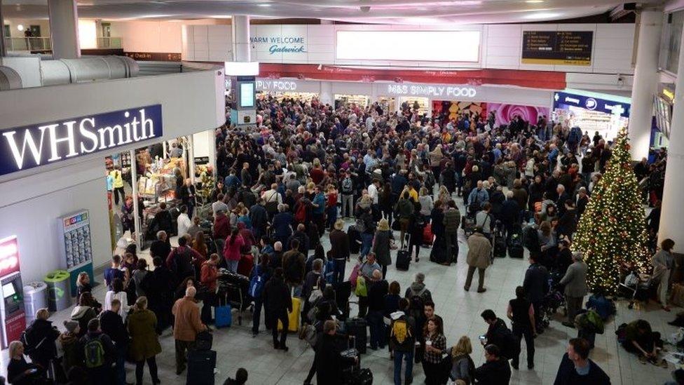 Passengers returning to the North Terminal