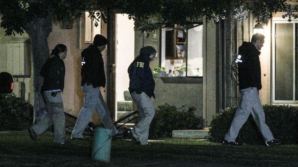 US police search a home in California, thought to be connected to the perpetrators of a mass shooting