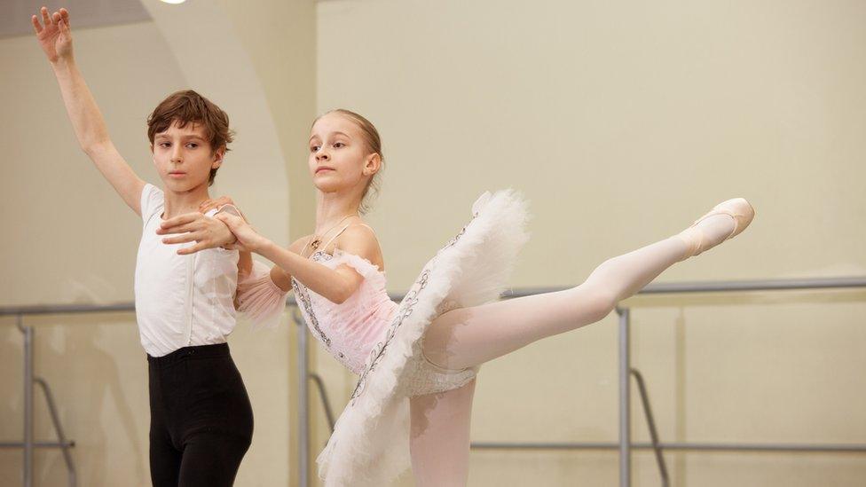 Children doing ballet.