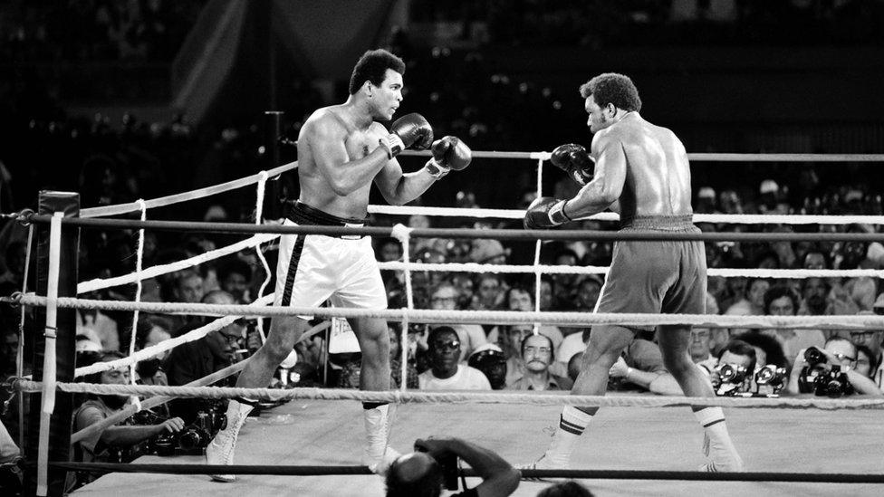 This file photo taken on October 30, 1974 shows Former world heavyweight champion Muhammad Ali (L) and titleholder US George Foreman (R) fighting on October 30, 1974 in Kinshasa, Zaire