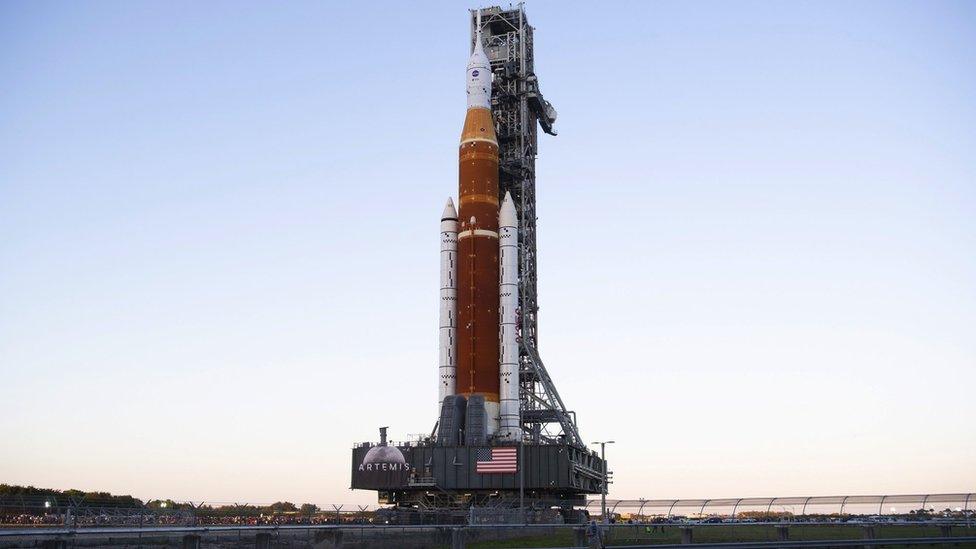 A handout photo made available by NASA shows NASA's Space Launch System (SLS) rocket with the Orion spacecraft aboard