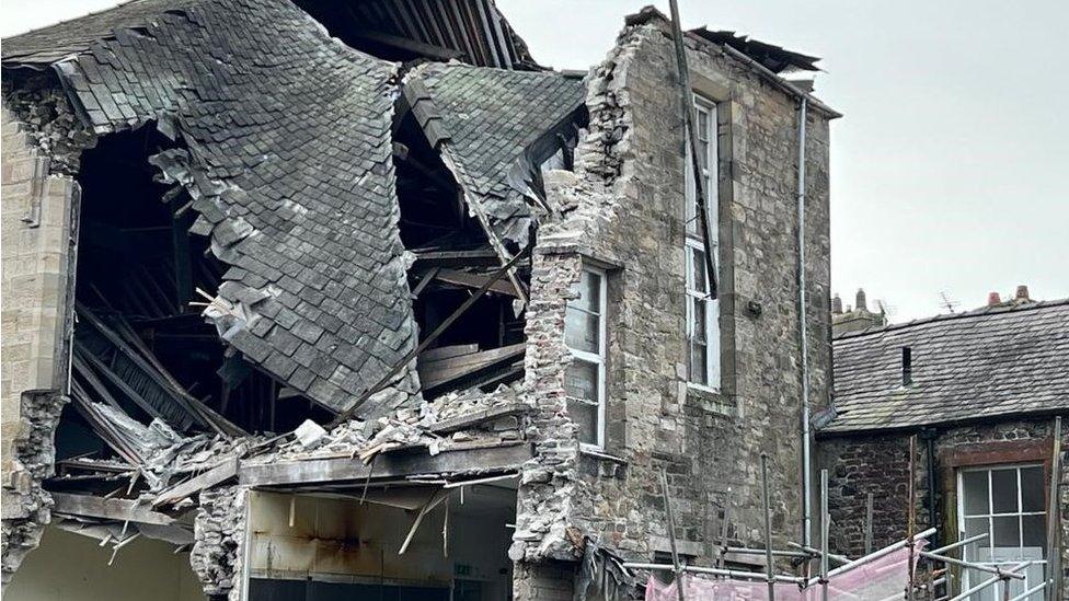 The collapsed roof of the building