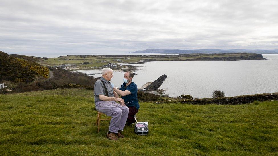 Dr Gavin Chestnut vaccinating a man on Rathlin Island