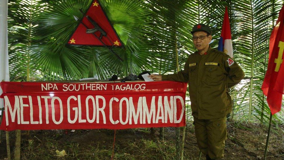 A photo taken on 23 November 2016 showing the NPA's new regional rebel commander and spokesman Jaime Padilla, who uses the nom de guerre Comrade Diego, answering questions from reporters in a clandestine news conference in the Sierra Madre mountains southeast of Manila, Philippines.