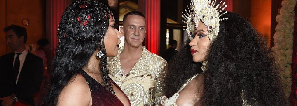 Nicki Minaj and Cardi B speak at the Met Gala in May 2018