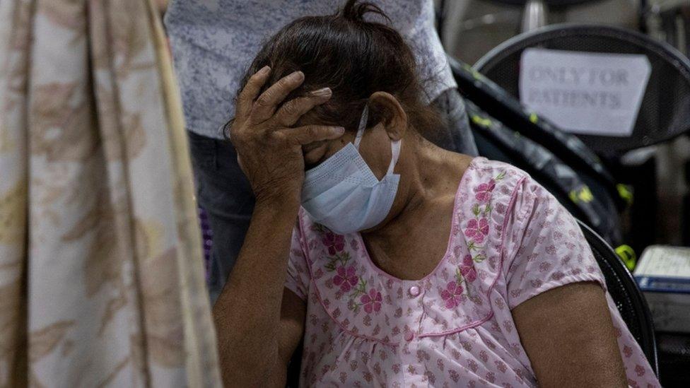 A patient suffering from the coronavirus disease Covid-19 is seen inside the emergency ward at Holy Family hospital in New Delhi.