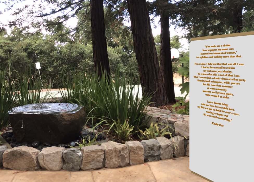 A scene of the garden at Stanford University with an augmented reality plaque bearing the words of Chanel Miller