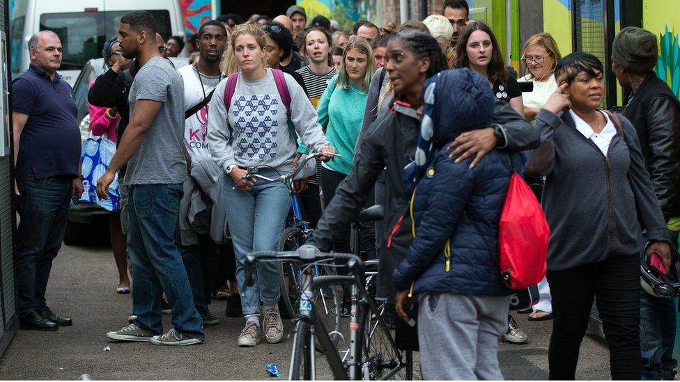 Kids Company staff leave one of the charity's Lambeth sites on the day it closed