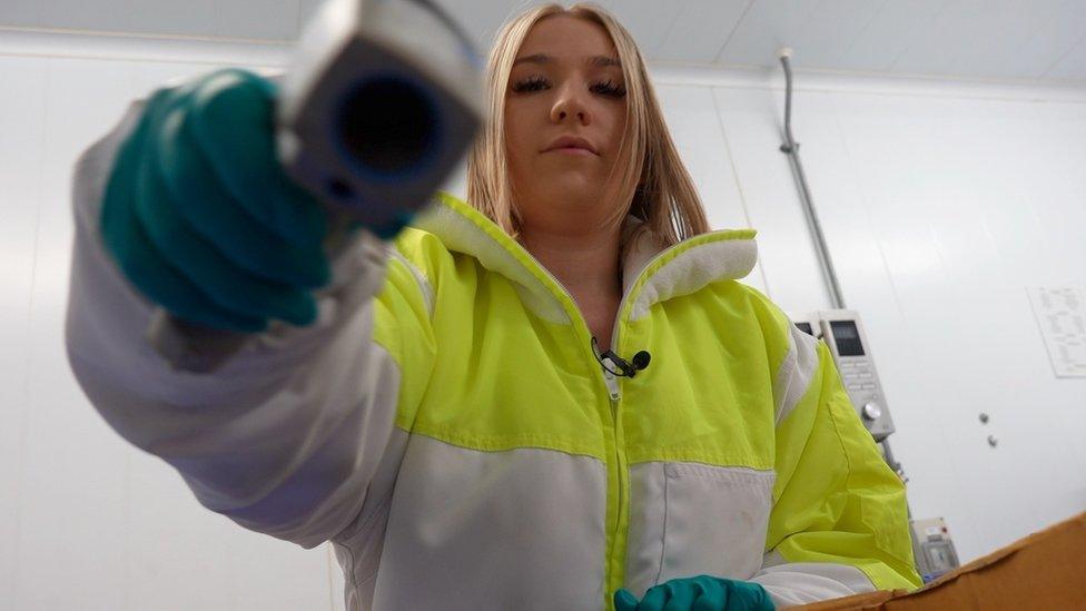 Natasha Varley checking the temperature of imported food