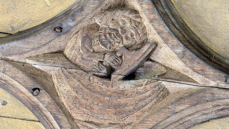 Carved boss at All Saints' Church in Gazeley