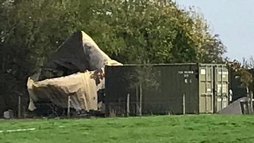 Damage to a container at the Event Horizon premises