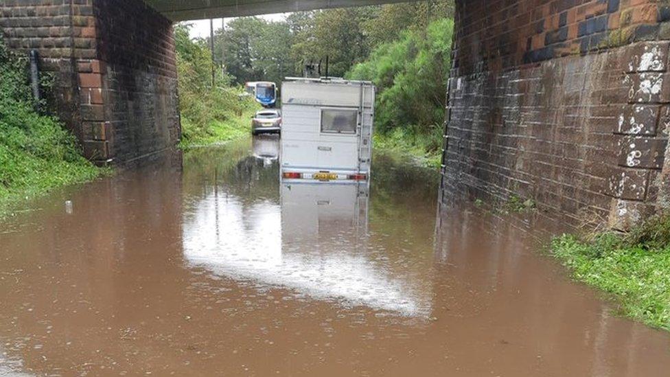 Cars and campervans flooded in tunnel