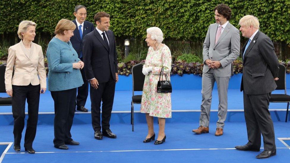 From left, President of the European Commission Ursula von der Leyen, Germany's Chancellor Angela Merkel, Japan's Prime Minister Yoshihide Suga, France's President Emmanuel Macron, Canada's Prime Minister Justin Trudeau, Britain's Prime Minister Boris Johnson, Italy's Prime minister Mario Draghi, President of the European Council Charles Michel, and US President Joe Biden during an evening reception at The Eden Project