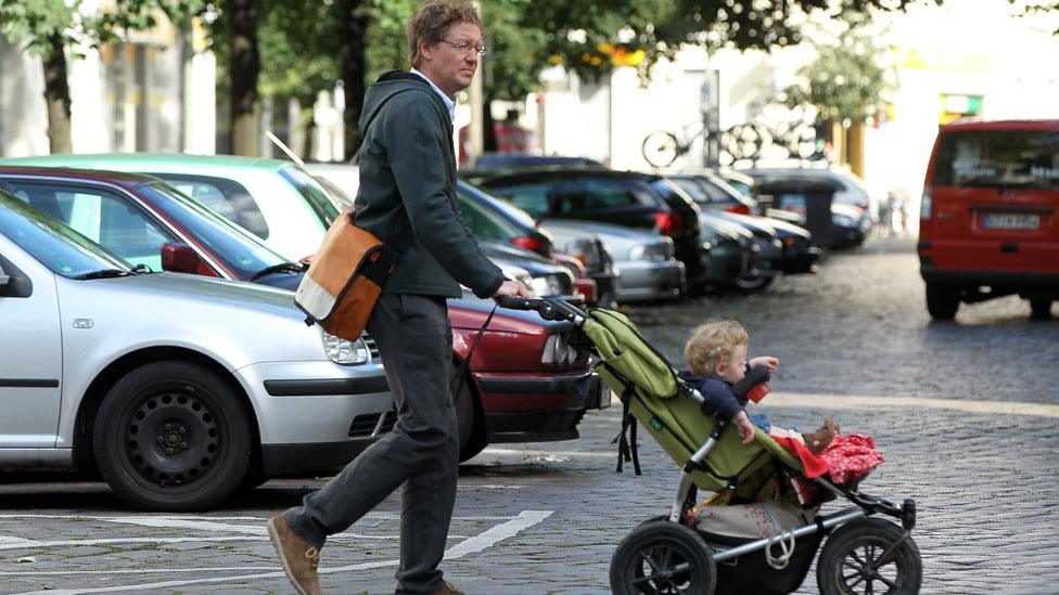 Parent pushing pram