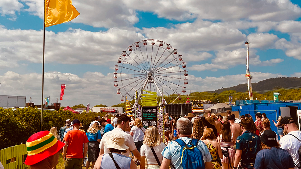 people entering a festival