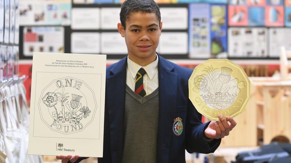 David Pearce holding his £1 coin design