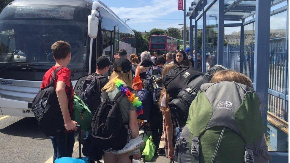 People at coaches and buses in Newquay