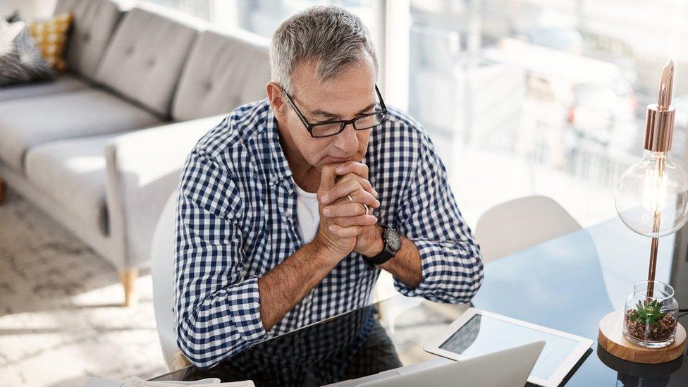 Middle-aged man working at laptop