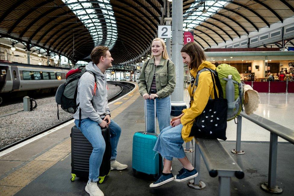 Students wait for train