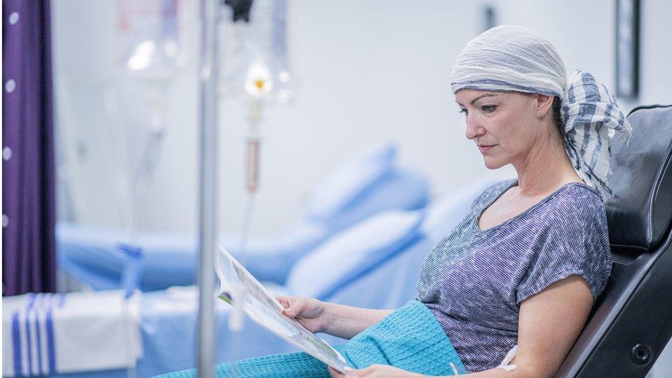 Woman receiving chemotherapy treatment