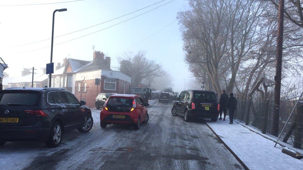 Cars stuck on ice in Penny Lane