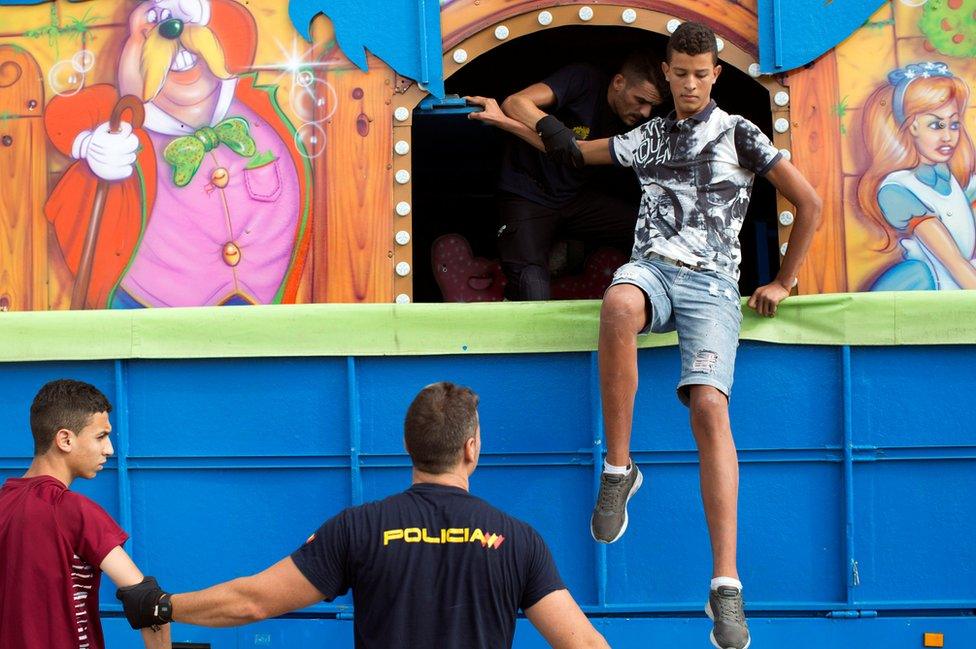 Police detain migrants who hid in fairground lorry in Ceuta, 7 Aug 17