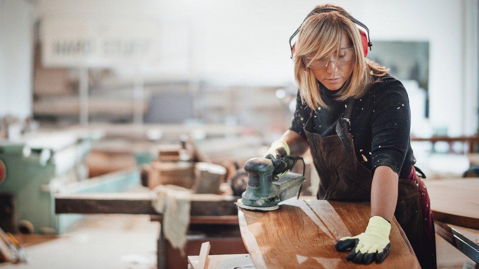 A woman making furniture