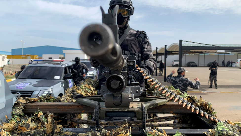 A member of security forces stands behind a weapon, in Tripoli, Libya - 1 February 2021