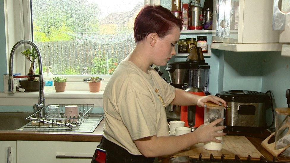 Lucie making tea in the kitchen