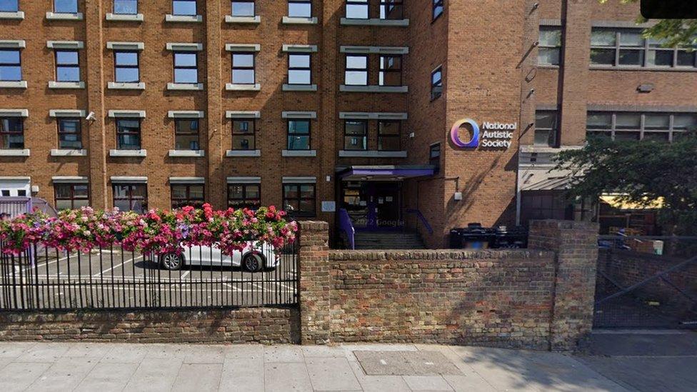 Brick building with small square windows and nameplate "National Autistic Society"