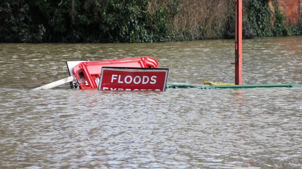 Flood signs underwater as floods have risen over them in Shrewsbury Shropshire during floods in February 2020