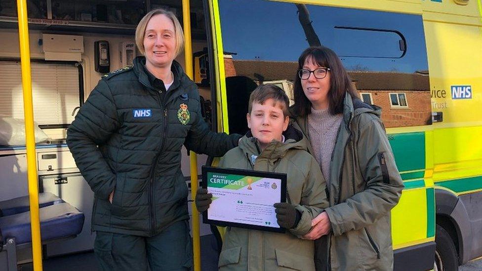 Harrison Teague his mother, Claire, and Paramedic Tracey Smith