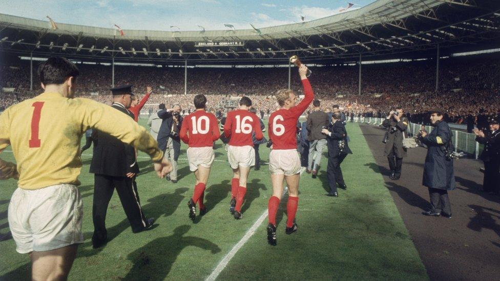 Bobby Moore leads Martin Peters, Geoff Hurst and Gordon Banks round the lap of honour at Wembley after the 1966 World Cup final