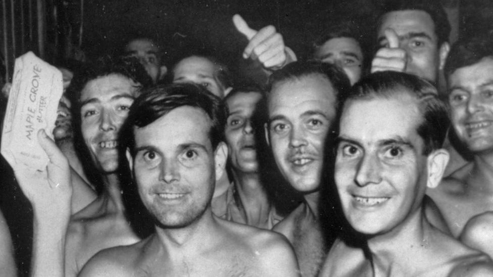 1945: Prisoners of War from the Allied forces eating food after being liberated from a Japanese Prisoner of War camp in Taiwan