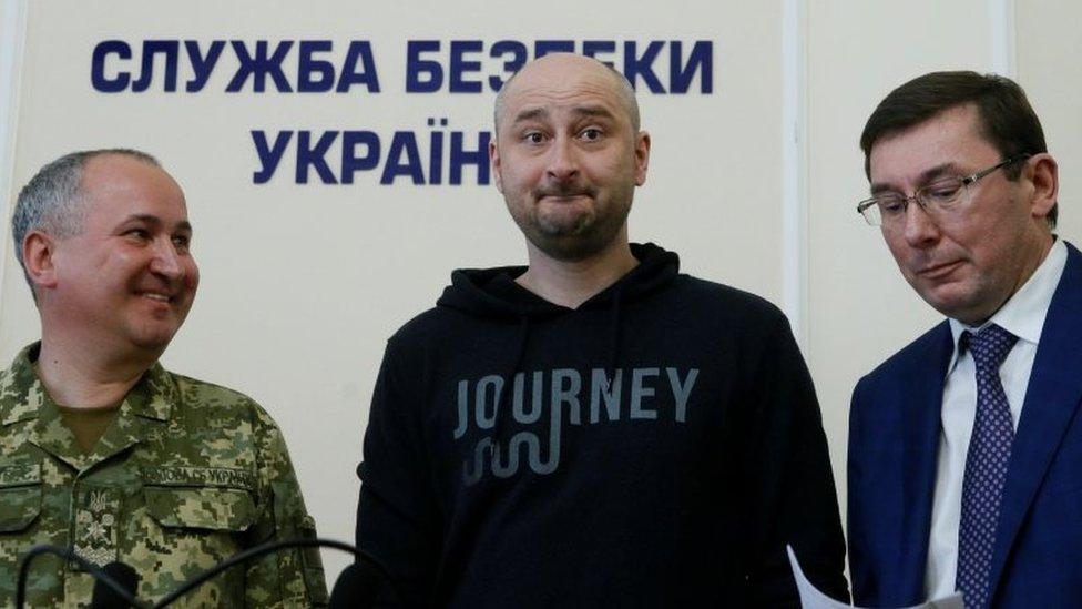 Russian journalist Arkady Babchenko (C), who was reported murdered in the Ukrainian capital on May 29, Ukrainian Prosecutor General Yuriy Lutsenko (R) and head of the state security service (SBU) Vasily Gritsak attend a news briefing in Kiev, Ukraine 30 May 2018.