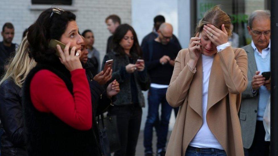 People outside Parsons Green Tube station