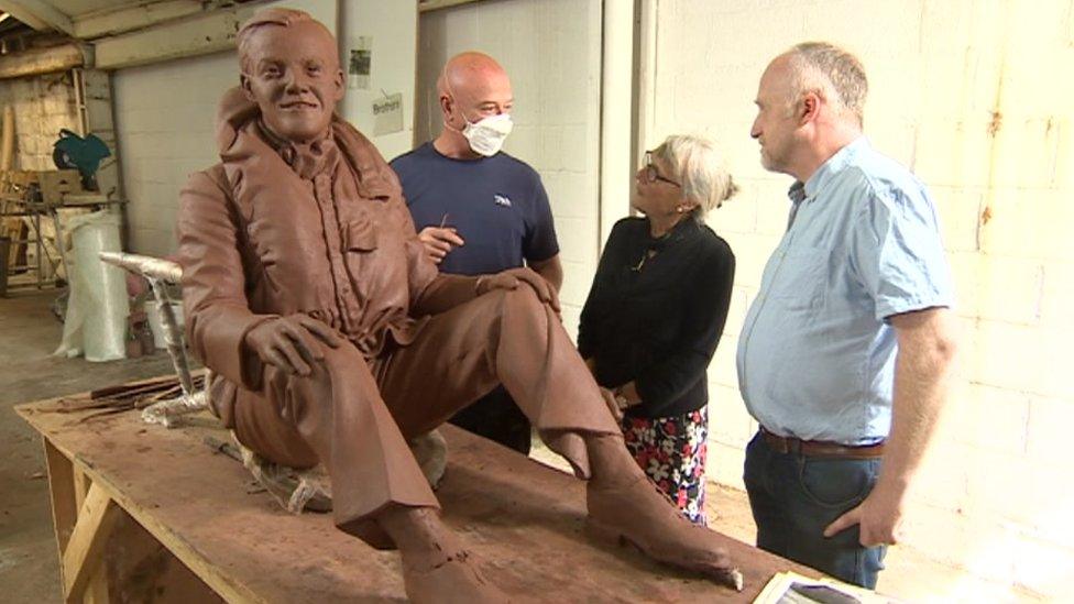 The clay statue of Flt Lt Peter Brothers with sculptor Stephen Melton, Hilary Cairn and Dave Brocklehurst