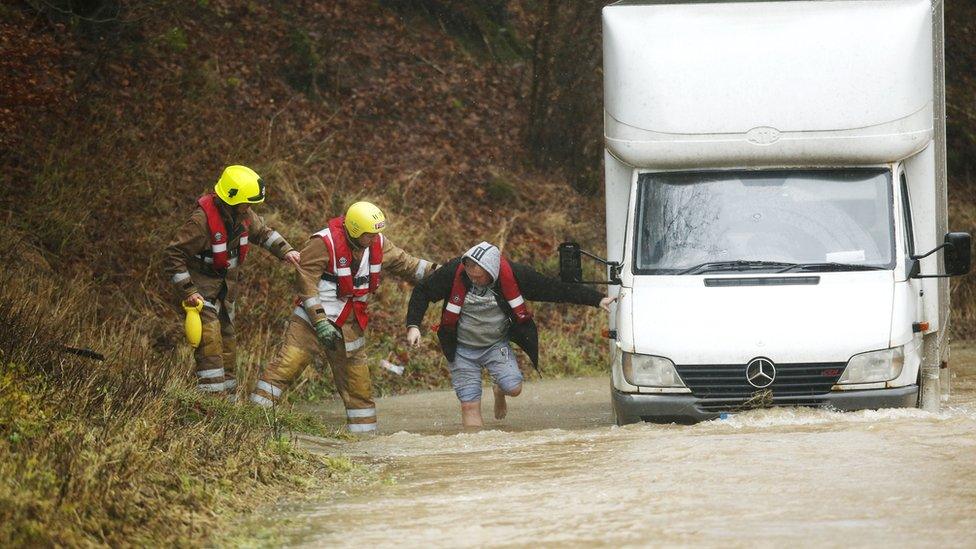 A driver was helped out of his van